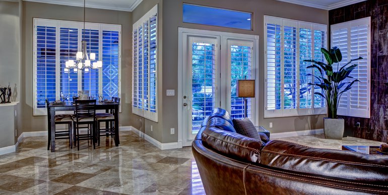 Chicago great room with plantation shutters and tile floor.